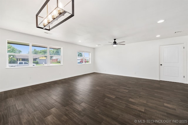 12317 E 18th St, Tulsa, OK 74128 - spare room with a ceiling fan, dark wood-type flooring, and recessed lighting