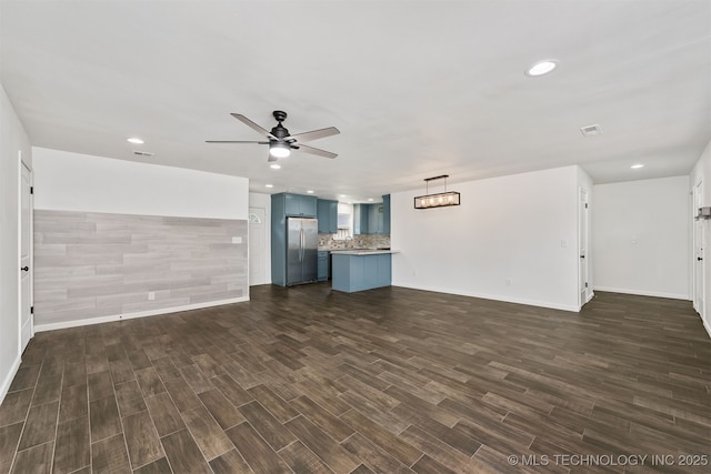 12317 E 18th St, Tulsa, OK 74128 - unfurnished living room featuring ceiling fan, dark wood finished floors, and recessed lighting