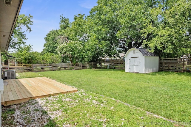 12317 E 18th St, Tulsa, OK 74128 - fenced backyard with a shed, a wooden deck, and view of scattered trees