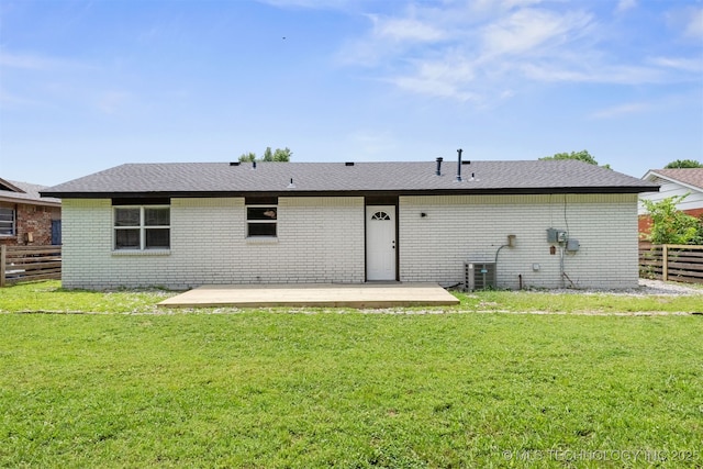 12317 E 18th St, Tulsa, OK 74128 - back of house featuring brick siding and a patio area