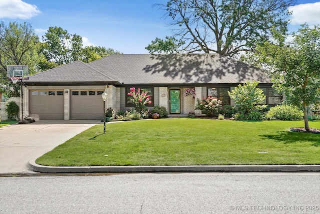 5861 S Hudson Pl, Tulsa, OK 74135 - view of front of property with an attached garage, a front lawn, driveway, and brick siding