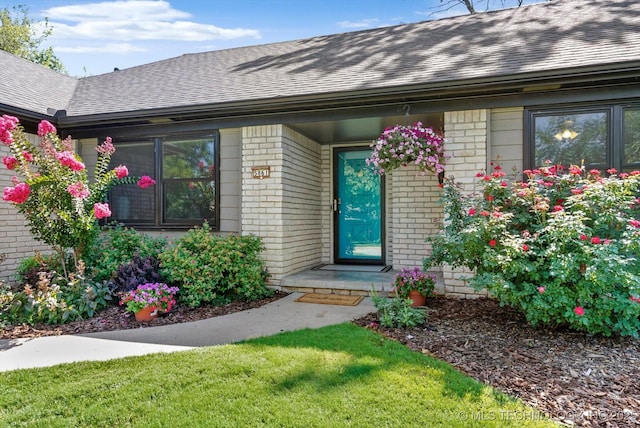 5861 S Hudson Pl, Tulsa, OK 74135 - property entrance with brick siding and a shingled roof