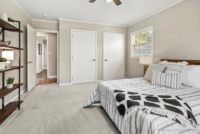 5861 S Hudson Pl, Tulsa, OK 74135 - bedroom with carpet, ornamental molding, ceiling fan, and multiple closets