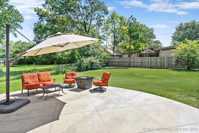 5861 S Hudson Pl, Tulsa, OK 74135 - fenced backyard with a fire pit and a patio
