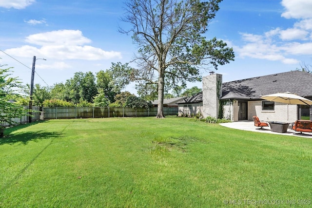 5861 S Hudson Pl, Tulsa, OK 74135 - fenced backyard with a patio