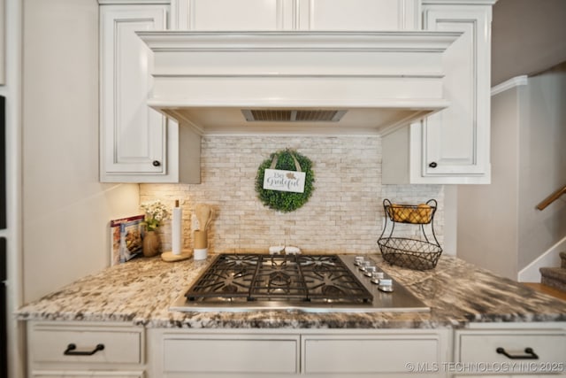 11802 S New Haven Ave, Tulsa, OK 74137 - kitchen featuring custom range hood, decorative backsplash, stainless steel gas stovetop, light stone counters, and ornamental molding