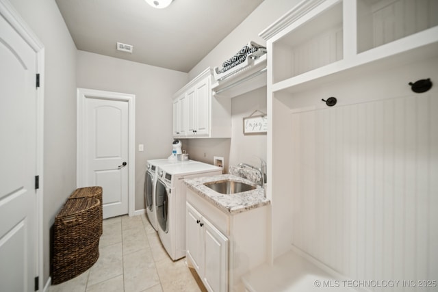 11802 S New Haven Ave, Tulsa, OK 74137 - laundry area with cabinet space, independent washer and dryer, and light tile patterned flooring