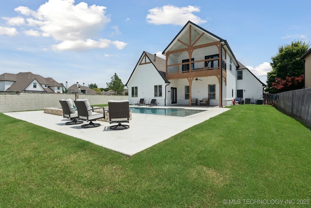 11802 S New Haven Ave, Tulsa, OK 74137 - back of house with ceiling fan, a balcony, a patio, and a fenced backyard