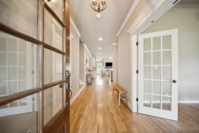 11802 S New Haven Ave, Tulsa, OK 74137 - hall featuring ornamental molding, light wood-style floors, french doors, a chandelier, and recessed lighting
