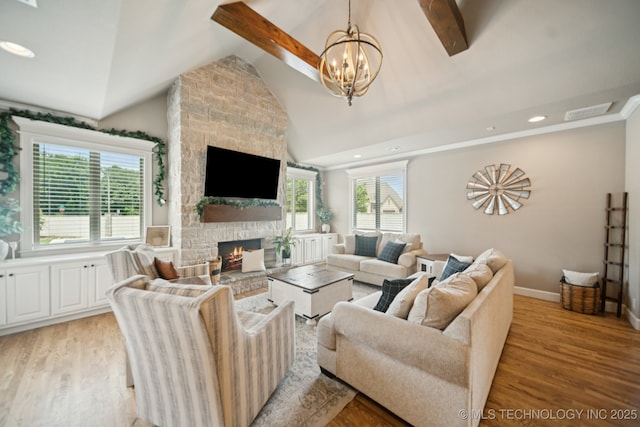 11802 S New Haven Ave, Tulsa, OK 74137 - living area with vaulted ceiling, a stone fireplace, light wood-style floors, a chandelier, and recessed lighting