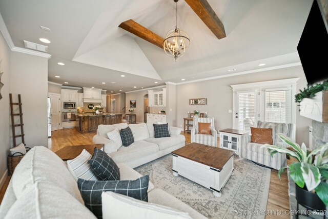 11802 S New Haven Ave, Tulsa, OK 74137 - living area featuring light wood finished floors, a chandelier, crown molding, and recessed lighting