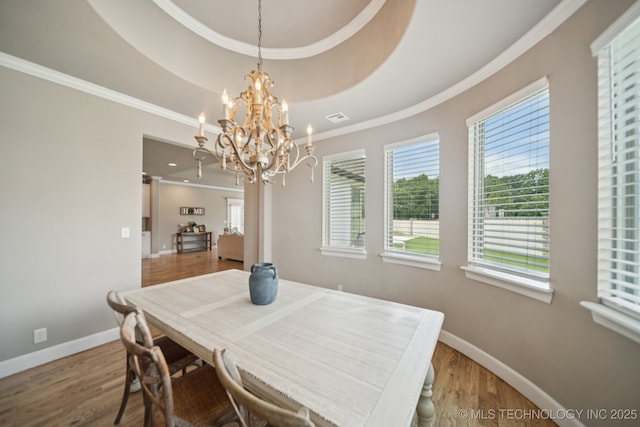 11802 S New Haven Ave, Tulsa, OK 74137 - dining room with a chandelier, crown molding, wood finished floors, and a tray ceiling
