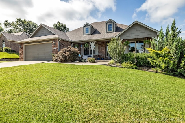 3331 Bunker St, Claremore, OK 74019 - view of front of property with a garage, brick siding, and a front lawn