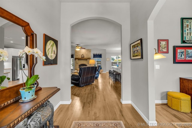 3331 Bunker St, Claremore, OK 74019 - hall with arched walkways and light wood-style flooring