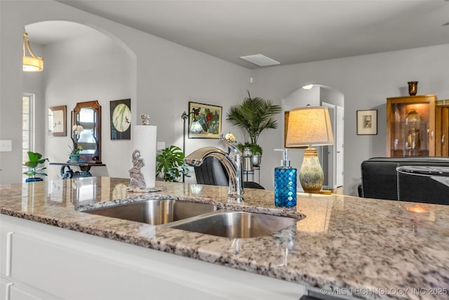 3331 Bunker St, Claremore, OK 74019 - kitchen with arched walkways and light stone counters
