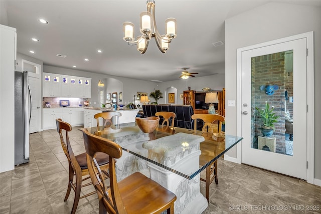 3331 Bunker St, Claremore, OK 74019 - dining space with arched walkways, a chandelier, recessed lighting, and a ceiling fan
