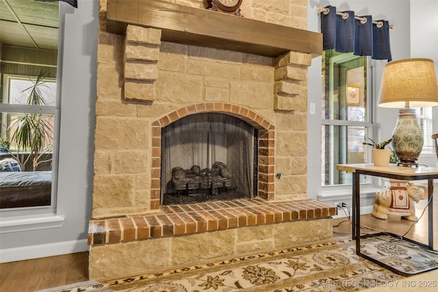 3331 Bunker St, Claremore, OK 74019 - detailed view of wood finished floors and a fireplace with raised hearth