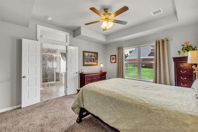 3331 Bunker St, Claremore, OK 74019 - carpeted bedroom featuring a ceiling fan and a tray ceiling