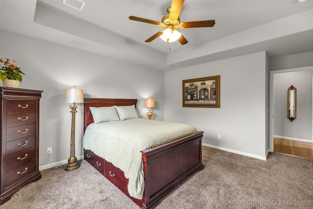 3331 Bunker St, Claremore, OK 74019 - carpeted bedroom with a tray ceiling and ceiling fan