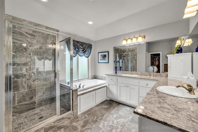 3331 Bunker St, Claremore, OK 74019 - bathroom featuring two vanities, a shower stall, a bath, marble look tiles, and recessed lighting
