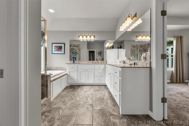 3331 Bunker St, Claremore, OK 74019 - full bathroom featuring a shower stall, vanity, a garden tub, and recessed lighting