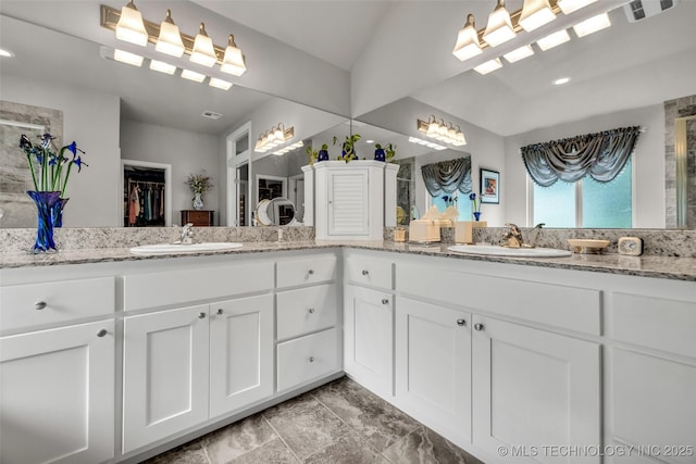 3331 Bunker St, Claremore, OK 74019 - full bathroom with double vanity, a spacious closet, and recessed lighting