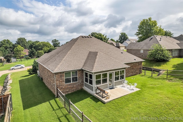 3331 Bunker St, Claremore, OK 74019 - rear view of property featuring brick siding, a fenced backyard, roof with shingles, and a patio