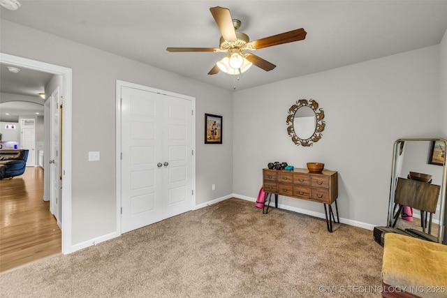 3331 Bunker St, Claremore, OK 74019 - bedroom featuring arched walkways, carpet flooring, and ceiling fan