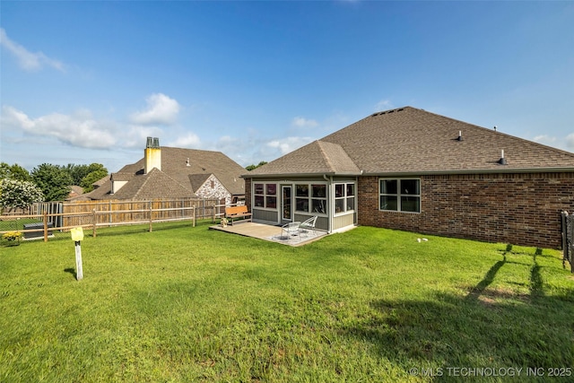 3331 Bunker St, Claremore, OK 74019 - rear view of house with a fenced backyard, roof with shingles, a patio, and brick siding