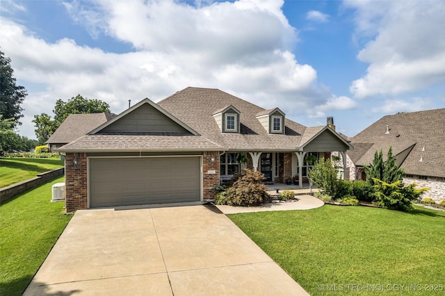 3331 Bunker St, Claremore, OK 74019 - view of front of house with brick siding, covered porch, a garage, a front yard, and roof with shingles