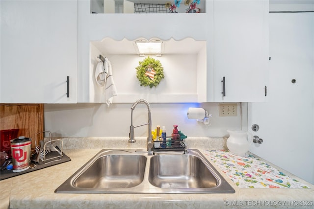 4647 S 30th W Ave, Tulsa, OK 74107 - kitchen featuring light countertops and white cabinetry
