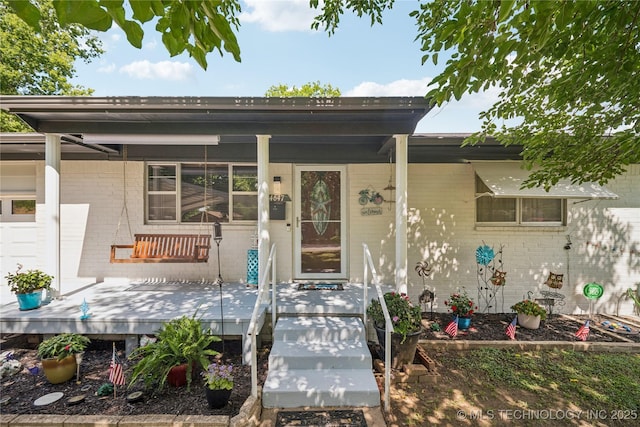 4647 S 30th W Ave, Tulsa, OK 74107 - property entrance featuring brick siding and a porch