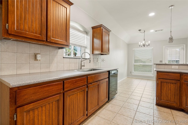 9005 N 154th E Ct, Owasso, OK 74055 - kitchen with black dishwasher, vaulted ceiling, decorative backsplash, brown cabinets, and light countertops