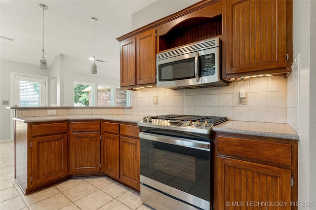 9005 N 154th E Ct, Owasso, OK 74055 - kitchen with stainless steel appliances, light tile patterned floors, backsplash, and brown cabinetry