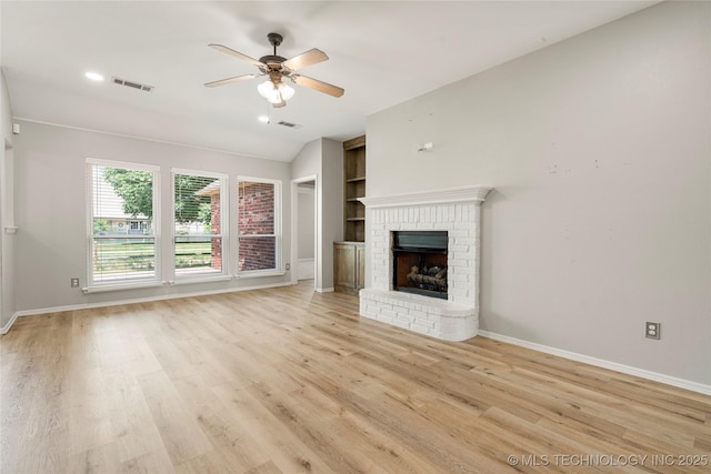 9005 N 154th E Ct, Owasso, OK 74055 - unfurnished living room with a ceiling fan, light wood finished floors, a fireplace, and recessed lighting