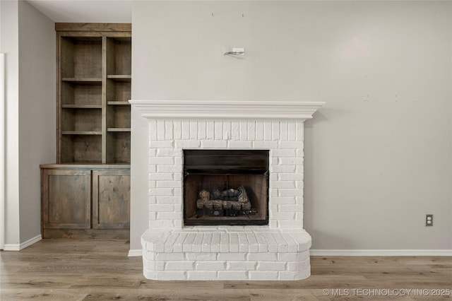 9005 N 154th E Ct, Owasso, OK 74055 - detailed view of wood finished floors and a fireplace