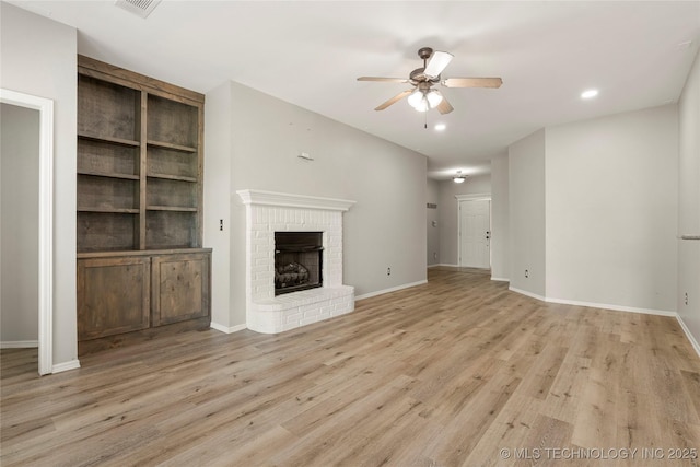 9005 N 154th E Ct, Owasso, OK 74055 - unfurnished living room featuring a ceiling fan, light wood-style floors, a fireplace, and recessed lighting