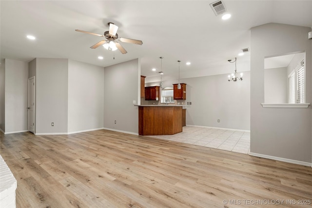 9005 N 154th E Ct, Owasso, OK 74055 - unfurnished living room featuring a ceiling fan, light wood-type flooring, a chandelier, and recessed lighting
