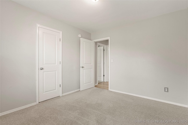 9005 N 154th E Ct, Owasso, OK 74055 - unfurnished bedroom featuring carpet flooring and baseboards