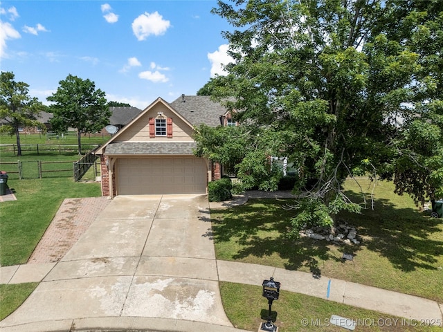9005 N 154th E Ct, Owasso, OK 74055 - view of front of house with brick siding, concrete driveway, an attached garage, and roof with shingles
