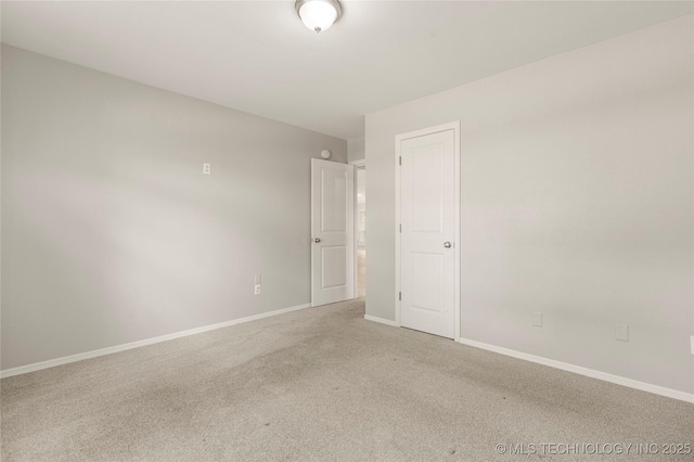 9005 N 154th E Ct, Owasso, OK 74055 - unfurnished room with light colored carpet and baseboards