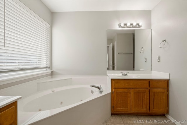 9005 N 154th E Ct, Owasso, OK 74055 - bathroom featuring vanity, a whirlpool tub, and tile patterned flooring