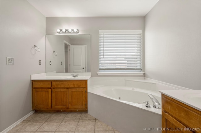 9005 N 154th E Ct, Owasso, OK 74055 - bathroom with vanity, a jetted tub, and tile patterned floors