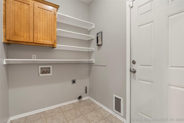 9005 N 154th E Ct, Owasso, OK 74055 - washroom featuring cabinet space, washer hookup, hookup for an electric dryer, and light tile patterned floors