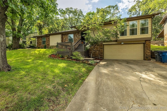 4350 E 74th Pl, Tulsa, OK 74136 - view of front of house featuring a garage, driveway, a front lawn, and stone siding