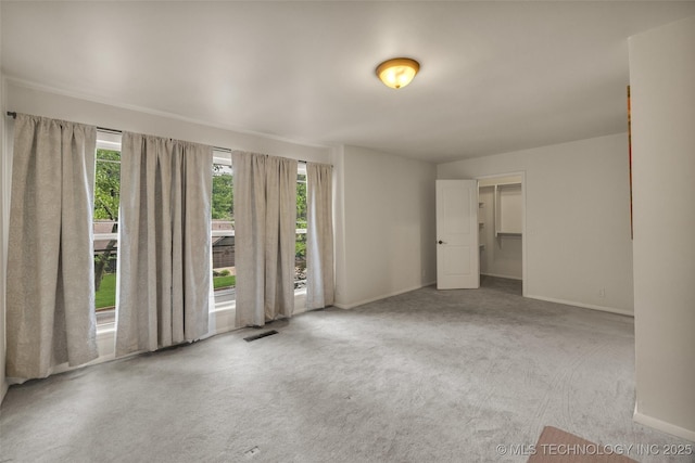 4350 E 74th Pl, Tulsa, OK 74136 - carpeted empty room with plenty of natural light