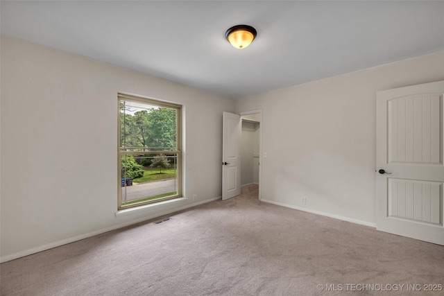 4350 E 74th Pl, Tulsa, OK 74136 - unfurnished bedroom featuring carpet and baseboards
