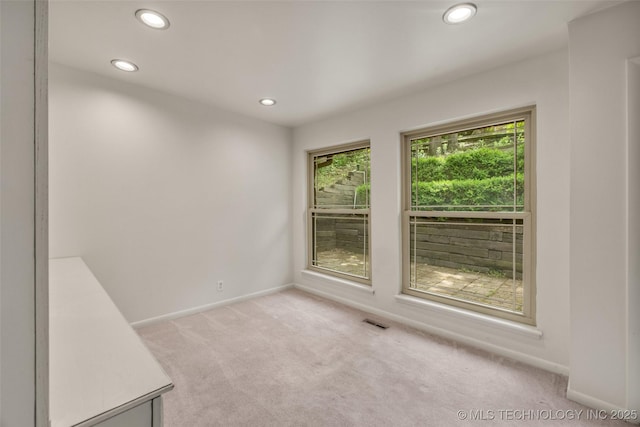 4350 E 74th Pl, Tulsa, OK 74136 - unfurnished room with light carpet and recessed lighting