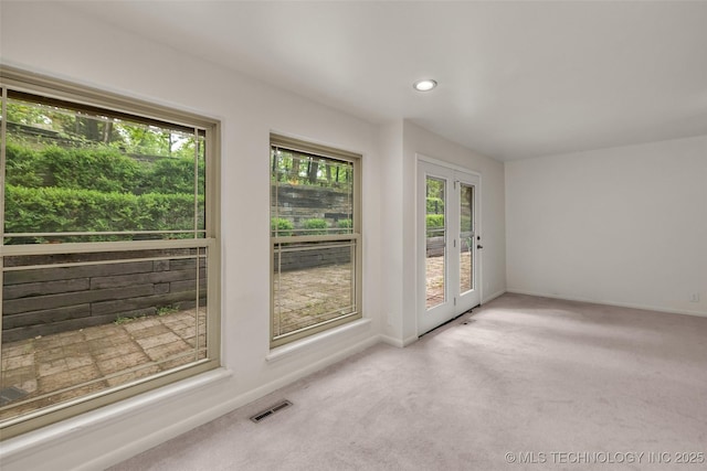 4350 E 74th Pl, Tulsa, OK 74136 - carpeted empty room featuring healthy amount of natural light, recessed lighting, and french doors