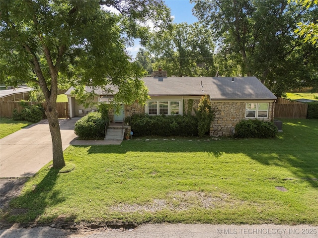 1640 E 41st St, Tulsa, OK 74105 - view of front of house with stone siding, concrete driveway, an attached garage, and a chimney